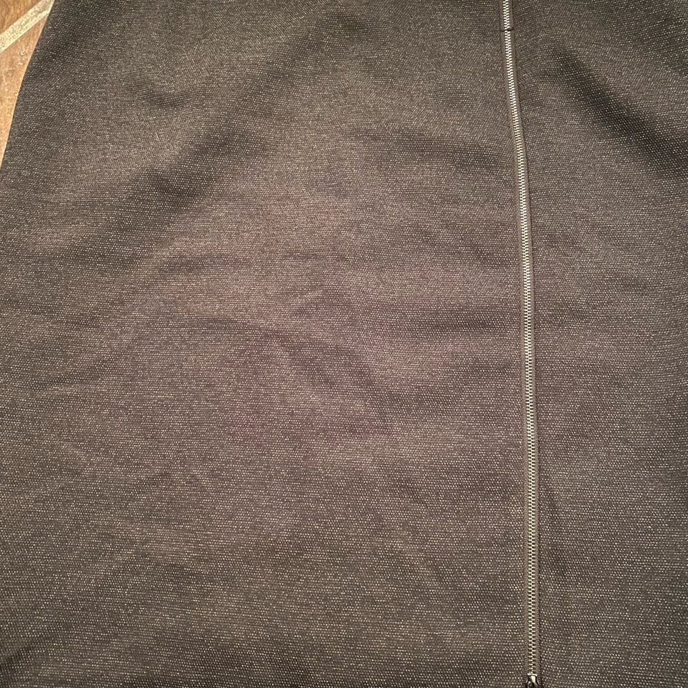 A chic black tweed-y skirt that is super flattering. Zipper detail, knee length.